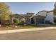 Single-Gathering home with stone accents, tiled roof, and desert landscaping at 3049 E Longhorn Dr, Gilbert, AZ 85297
