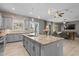 Bright, open kitchen with island, gray cabinets, granite countertops, stainless appliances and an open floor plan at 3049 E Longhorn Dr, Gilbert, AZ 85297