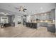 Spacious open-plan kitchen with a central island, sleek appliances, and an adjacent dining area at 3049 E Longhorn Dr, Gilbert, AZ 85297