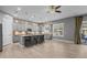 Bright and airy kitchen showcasing gray cabinets, large windows, a kitchen island and an open floor plan at 3049 E Longhorn Dr, Gilbert, AZ 85297