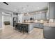 Well-equipped kitchen featuring modern appliances, gray cabinetry, a kitchen island, and stylish pendant lights at 3049 E Longhorn Dr, Gilbert, AZ 85297