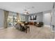 Spacious living room with tile floors and large windows for ample natural light, perfect for relaxation at 3049 E Longhorn Dr, Gilbert, AZ 85297