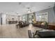 Open floor plan featuring a spacious living room, kitchen, and dining area, perfect for entertaining at 3049 E Longhorn Dr, Gilbert, AZ 85297