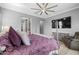 Comfortable primary bedroom with a decorative bed, wood-look floors, and a ceiling fan at 3049 E Longhorn Dr, Gilbert, AZ 85297