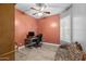 The cozy office has an orange accent wall at 3049 E Longhorn Dr, Gilbert, AZ 85297