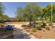 Community park with mature trees, playground, walking paths, and benches, perfect for recreation at 3049 E Longhorn Dr, Gilbert, AZ 85297