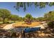 Community park and playground with climbing features, swings, slides, walking paths, picnic tables, and benches at 3049 E Longhorn Dr, Gilbert, AZ 85297