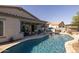 Gorgeous pool with pavers, and nearby covered patio, which enhances the home's outdoor living space at 3049 E Longhorn Dr, Gilbert, AZ 85297