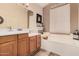Well-appointed bathroom with double sinks, soaking tub, and contemporary finishes at 3440 E Southern Ave # 1088, Mesa, AZ 85204