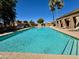 Community pool with lots of lounge chairs at 3440 E Southern Ave # 1088, Mesa, AZ 85204