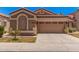 Charming single-story home featuring a two-car garage, desert landscaping and a timeless, neutral color palette at 3440 E Southern Ave # 1088, Mesa, AZ 85204