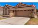 Attractive single-story house featuring an attached two-car garage, a well-maintained lawn and a neutral color scheme at 3440 E Southern Ave # 1088, Mesa, AZ 85204