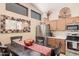 Well-lit eat-in kitchen showcases oak cabinets, stainless steel appliances, and charming dining area at 3440 E Southern Ave # 1088, Mesa, AZ 85204