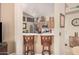 Cozy kitchen features bar seating and stainless steel appliances, perfect for casual dining and entertaining at 3440 E Southern Ave # 1088, Mesa, AZ 85204