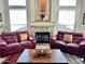 Cozy living room featuring a stone fireplace, comfortable seating, and natural light creating an inviting space at 3440 E Southern Ave # 1088, Mesa, AZ 85204