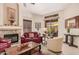 Inviting living room featuring a fireplace, a sliding glass door to the patio, and a cohesive, comfortable design at 3440 E Southern Ave # 1088, Mesa, AZ 85204