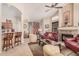 Bright living room showcasing a fireplace, bar seating, and elegant décor, creating a cozy and inviting atmosphere at 3440 E Southern Ave # 1088, Mesa, AZ 85204