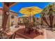 This patio offers a seating area, shade, and desert landscaping at 3440 E Southern Ave # 1088, Mesa, AZ 85204