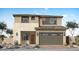 Contemporary two-story home featuring a neutral color palette and an attached two-car garage at 36007 N Bottling Dr, San Tan Valley, AZ 85140