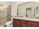 A spacious bathroom features double sinks with a granite countertop and a glass walk-in shower at 3622 E Sparrow Pl, Chandler, AZ 85286