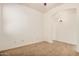 A carpeted bedroom features neutral walls and an arched entry to a tiled area at 3622 E Sparrow Pl, Chandler, AZ 85286