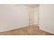 A carpeted bedroom features neutral walls and an interior door leading to other rooms at 3622 E Sparrow Pl, Chandler, AZ 85286