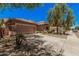 Beautiful home featuring stone accents, a two-car garage, and a driveway with mature landscaping at 3622 E Sparrow Pl, Chandler, AZ 85286