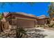Charming single-story home featuring a tile roof, stone accents, and a two-car garage at 3622 E Sparrow Pl, Chandler, AZ 85286