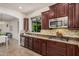 Kitchen features stainless steel appliances, granite countertops and mosaic tile backsplash at 3622 E Sparrow Pl, Chandler, AZ 85286