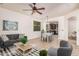 Comfortable living room featuring modern furniture, ceiling fan, and tile flooring at 3622 E Sparrow Pl, Chandler, AZ 85286