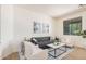 Comfortable living room with neutral colors, a gray sofa, two armchairs, and natural light at 3622 E Sparrow Pl, Chandler, AZ 85286