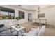 Open-concept living space with a casual dining area, comfortable seating, and plenty of natural light at 3622 E Sparrow Pl, Chandler, AZ 85286