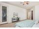 Bright main bedroom features a ceiling fan, a glass door and a console table at 3622 E Sparrow Pl, Chandler, AZ 85286