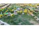 Aerial view of a well-maintained park with playground, green grass, and mature trees at 3622 E Sparrow Pl, Chandler, AZ 85286