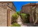 Charming side yard with desert landscaping, a gravel path, and mature plants enhancing the property's appeal at 3622 E Sparrow Pl, Chandler, AZ 85286