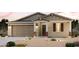 Charming single-Gathering home with a two-car garage, neutral color palette, and desert landscaping at 39970 W Sparks Ln, Maricopa, AZ 85138