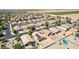 Aerial view of a neighborhood and farmland with homes and a pool at 40027 W Pryor Ln, Maricopa, AZ 85138