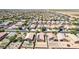 Aerial view of a neighborhood and farmland with homes featuring solar panels at 40027 W Pryor Ln, Maricopa, AZ 85138