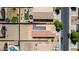 Aerial view of a home and neighborhood featuring solar panels and dirt backyard at 40027 W Pryor Ln, Maricopa, AZ 85138