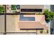 Aerial view of a home with solar panels and a dirt backyard at 40027 W Pryor Ln, Maricopa, AZ 85138