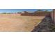 A large, empty backyard, ready for customization and landscaping to create your dream outdoor space at 40027 W Pryor Ln, Maricopa, AZ 85138