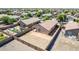 Aerial view of backyard with desert landscaping, play area, and fencing at 40027 W Pryor Ln, Maricopa, AZ 85138