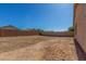 A large, empty backyard, ready for customization and landscaping to create your dream outdoor space at 40027 W Pryor Ln, Maricopa, AZ 85138