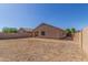Backyard featuring a patio area, with plenty of space for outdoor activities and entertainment at 40027 W Pryor Ln, Maricopa, AZ 85138