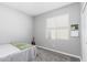 Bedroom with a guitar, window and closet at 40027 W Pryor Ln, Maricopa, AZ 85138