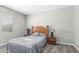 Cozy bedroom with a window, wooden bed frame and carpet flooring at 40027 W Pryor Ln, Maricopa, AZ 85138