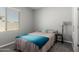 Bedroom with a bedside table, lamp and window at 40027 W Pryor Ln, Maricopa, AZ 85138