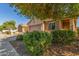 Exterior view of home, complemented by desert landscaping and low-maintenance greenery at 40027 W Pryor Ln, Maricopa, AZ 85138