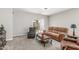 Inviting living room with comfortable seating, sliding glass door, and stylish decor at 40027 W Pryor Ln, Maricopa, AZ 85138