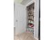 Walk-in pantry with plenty of shelving for food storage and household items at 40027 W Pryor Ln, Maricopa, AZ 85138